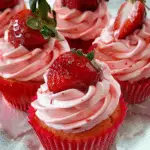 Sweet Strawberry Cupcakes with Whipped Pink Frosting and Fresh Fruit