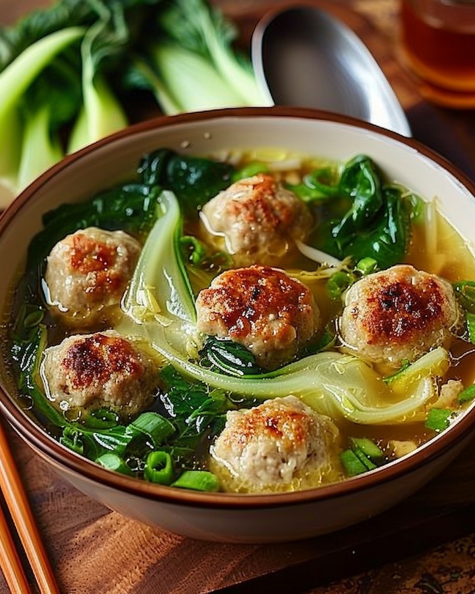 Ginger Chicken Meatball Soup with Baby Bok Choy and Wonton Strips