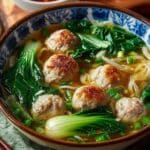 Ginger Chicken Meatball Soup with Baby Bok Choy and Wonton Strips