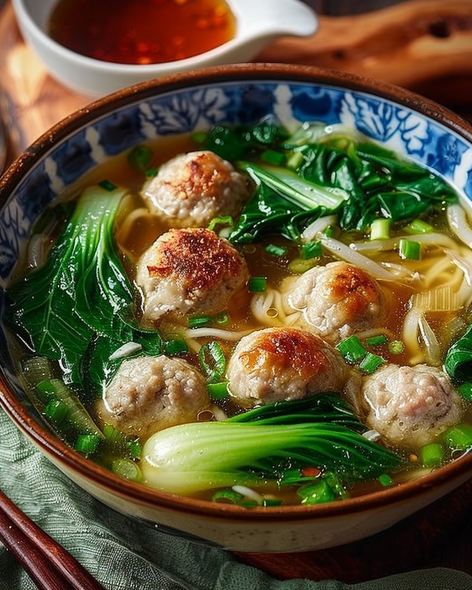 Ginger Chicken Meatball Soup with Baby Bok Choy and Wonton Strips