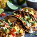 Sweet & Savory Teriyaki Chicken Tacos Topped with Grilled Pineapple Salsa and a Zesty Pineapple Lime Crema