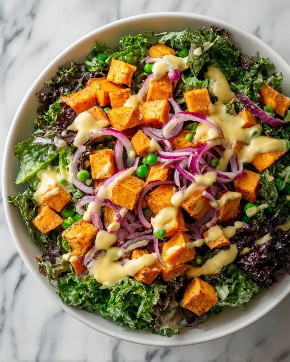 A white bowl filled with a colorful salad resting on a white marbled surface. The salad has three main layers: at the bottom is a fresh bed of green kale leaves with a slightly rough texture, followed by bright orange roasted sweet potato cubes scattered evenly on top. The final layer includes small green peas and toasted nuts or seeds sprinkled across the salad, adding a crunchy texture. Everything is lightly coated with a creamy dressing, visible as small patches that give a glossy shine. photo taken with an iphone --ar 4:5 --v 7