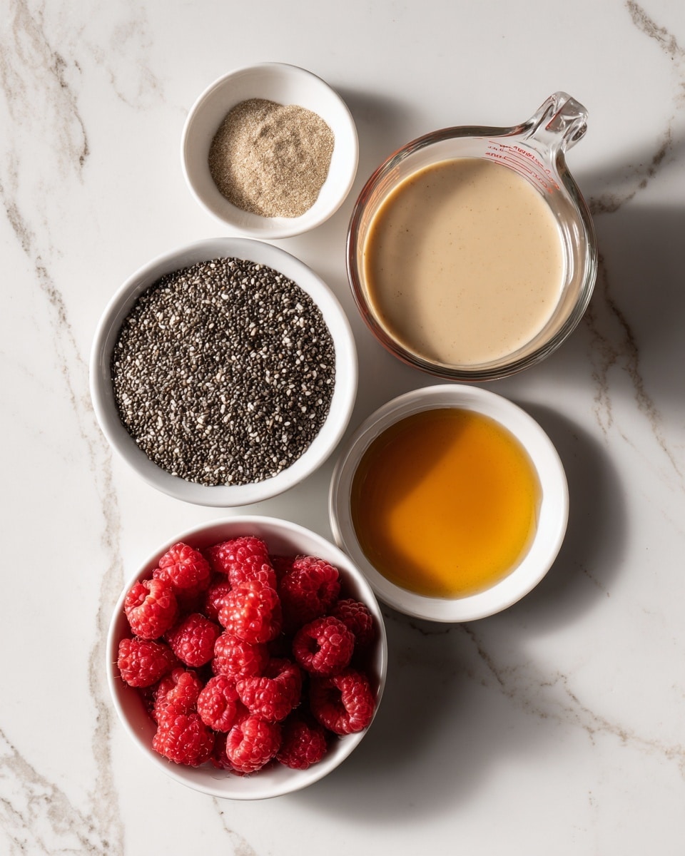 A set of six glass bowls and a measuring cup are placed on a white marbled surface. The measuring cup, filled halfway with a creamy beige liquid, sits at the top right. Below it, a medium-sized white bowl is filled with tiny black and grey chia seeds. To the left of it, a small white bowl contains light brown powder, while above it, a larger white bowl holds bright red raspberries. At the bottom center, there is a small white bowl with a shiny golden honey-like liquid. The lighting is bright and soft, showing clear details of the textures and colors. photo taken with an iphone --ar 4:5 --v 7