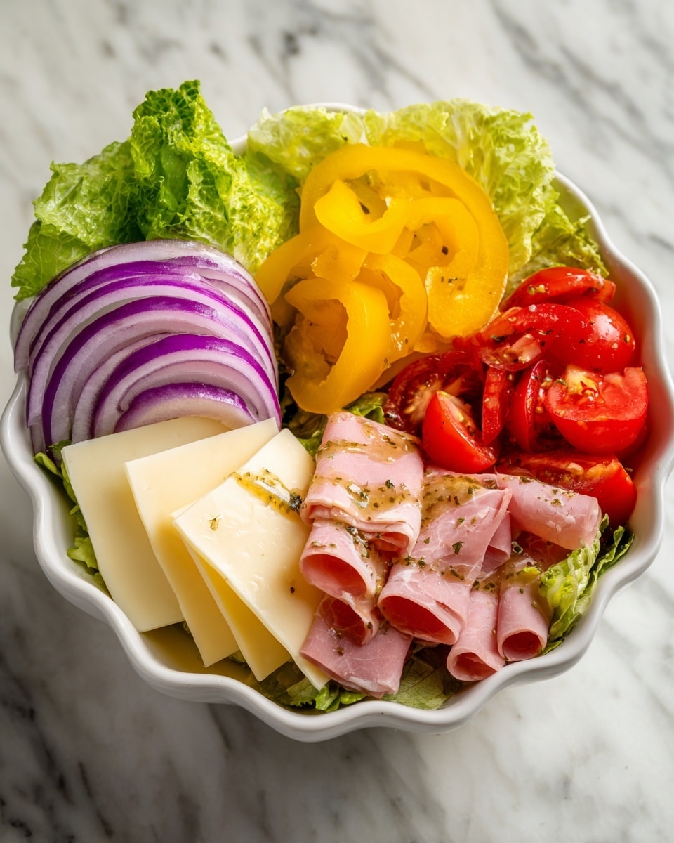 A white scalloped bowl holds a fresh salad with six distinct layers arranged side by side. Starting from the left, the first layer is green leafy romaine lettuce with a light dressing. Next, there are thin slices of purple-red onion. In the middle top section, bright yellow pepper rings are piled. Below and slightly overlapping, pale yellow square cheese slices are stacked. The right top part contains halved bright red cherry tomatoes. Finally, the bottom right and middle sections show two types of sliced deli meat in light pink and darker reddish-pink hues, all drizzled with a brown herb dressing. The bowl sits on a white marbled surface photo taken with an iphone --ar 4:5 --v 7